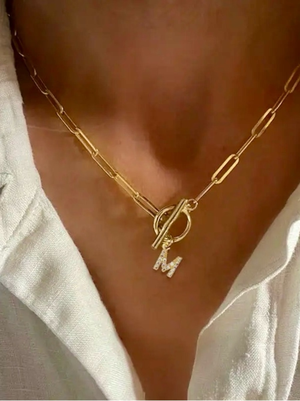 Gold-toned stainless steel paperclip chain necklace, cubic zirconia  "M" pendant